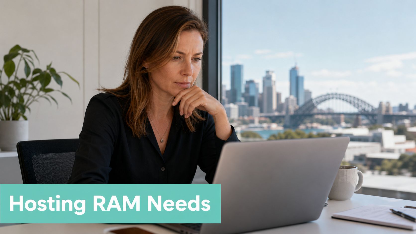 How Much RAM Do I Need? Your 2026 PC & Hosting Guide 5 A professional woman working on her laptop in an office with a scenic city view.