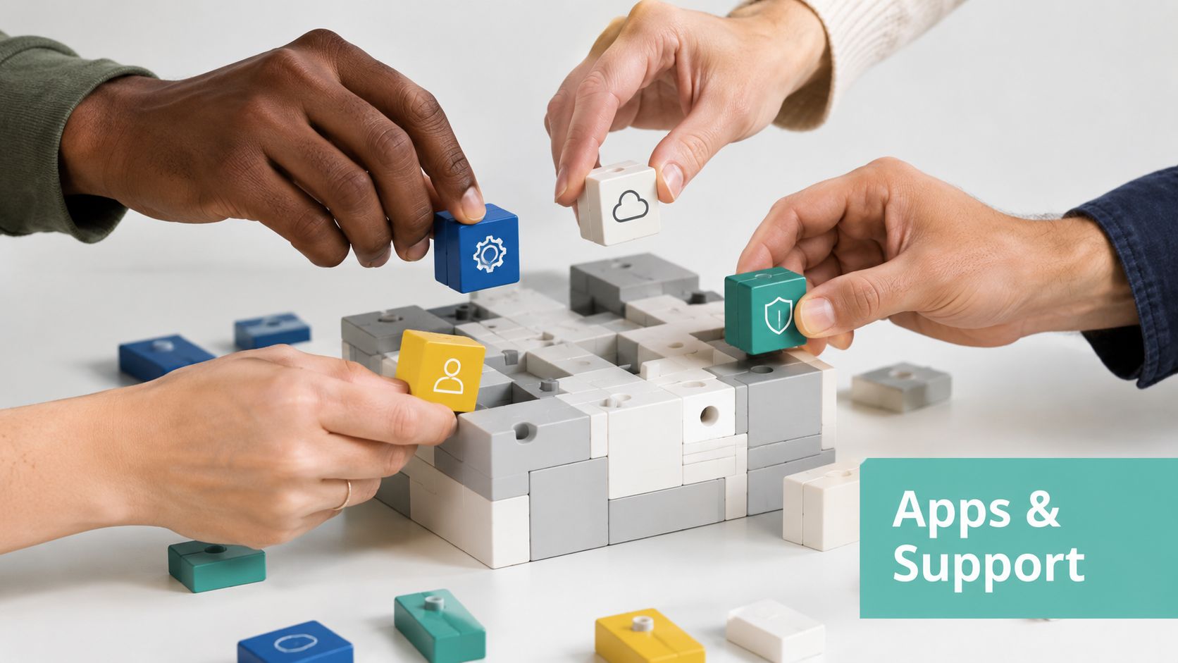Wix vs Shopify vs WooCommerce: The AU 2026 Guide 7 Four hands collaborating to build a structure with colorful plastic blocks on a white table.