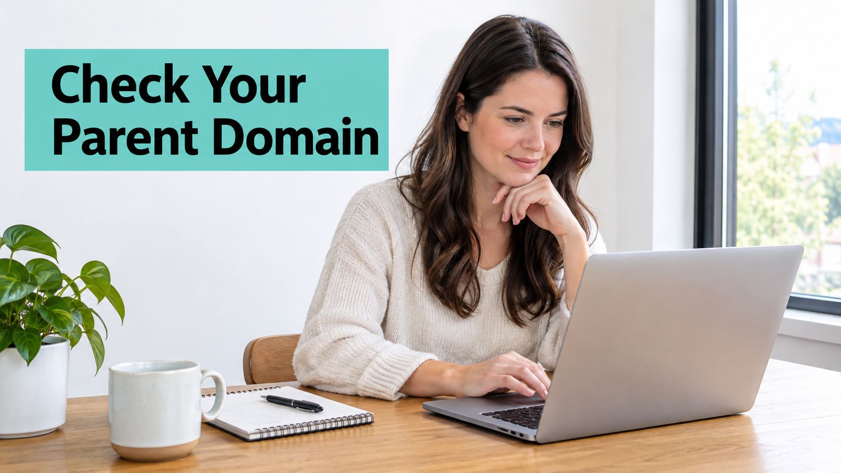 How to Create Subdomain in cPanel: A Step-by-Step Guide 2 A woman working on a laptop at a wooden desk with a plant and notebook nearby.